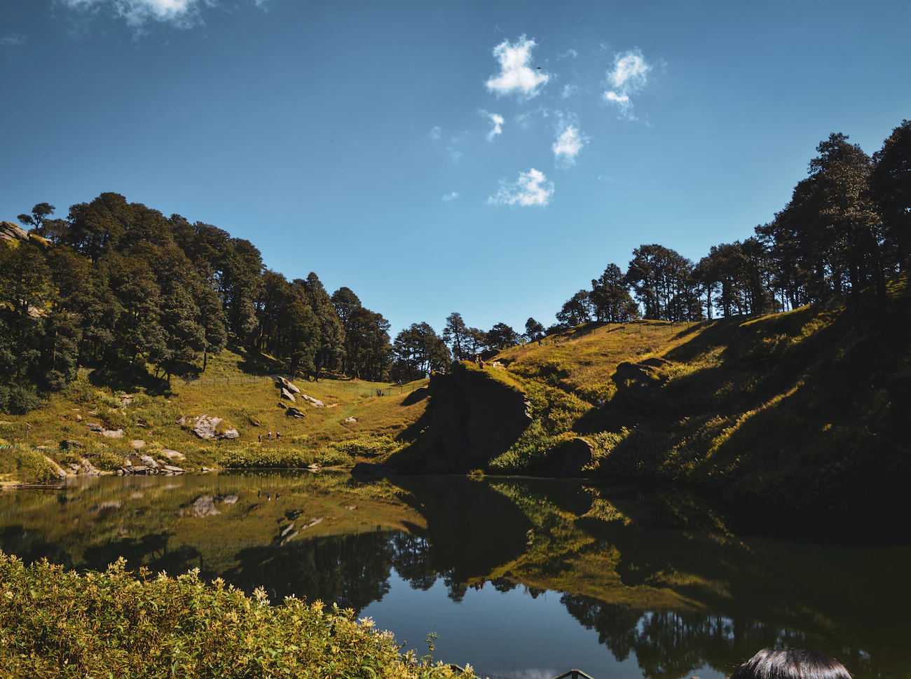 Mountain landscape with camping tent at sunset